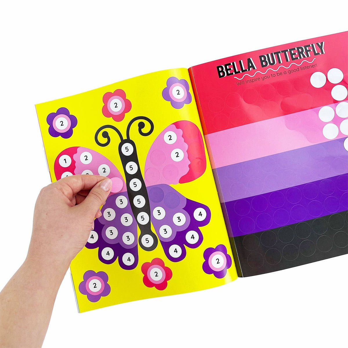Colorful children's book with butterfly illustration and hand interacting with the page.