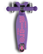 Purple scooter with pink 'Maxi Micro' branding on a white background