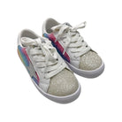 White sneakers with glittery gold soles and colorful stripes on a white background