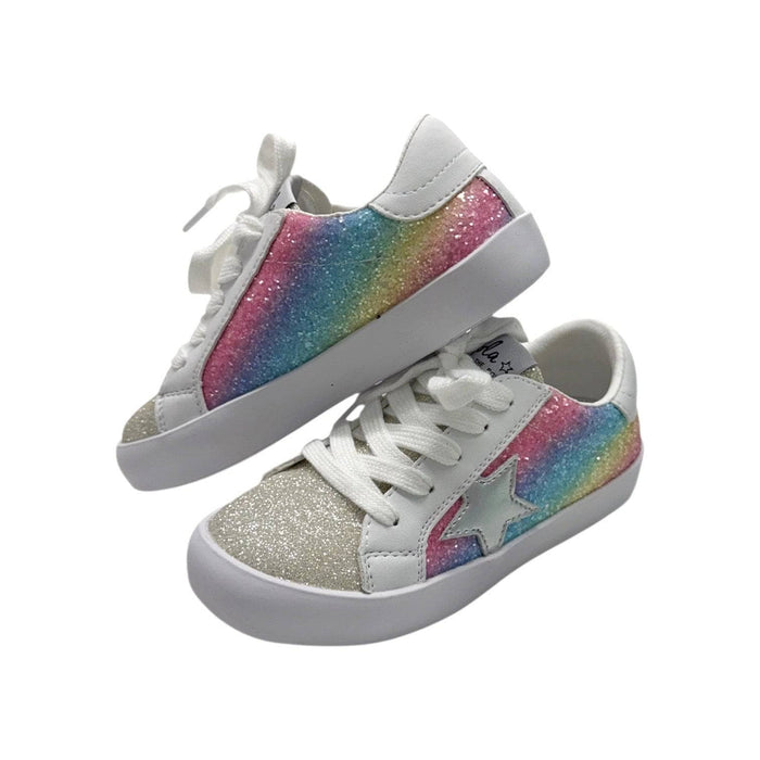 Pair of glittery sneakers with rainbow design on a white background