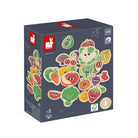 Box of colorful children's wooden toys shaped like fruits and vegetables on a white background
