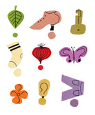 A set of nine colorful, abstractly shaped stickers or cutouts arranged on a plain white background, including a green leaf, peach shoe, gold key, cream sock, red hot air balloon, purple butterfly, orange flower, yellow question mark, and purple letter V.