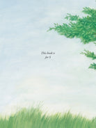 A page from the children's picture book The Wildest Thing by Emily Winfield Martin, featuring a dedication that reads "This book is for S" against a soft painted sky and grass illustration.