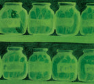 Green glass jars with plants on a green background.