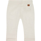 Beige pants with a brand label on a white background