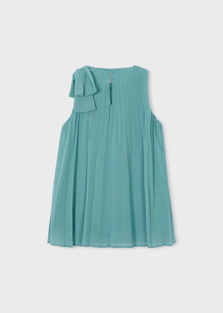Teal dress with ruffled shoulder on a light gray background