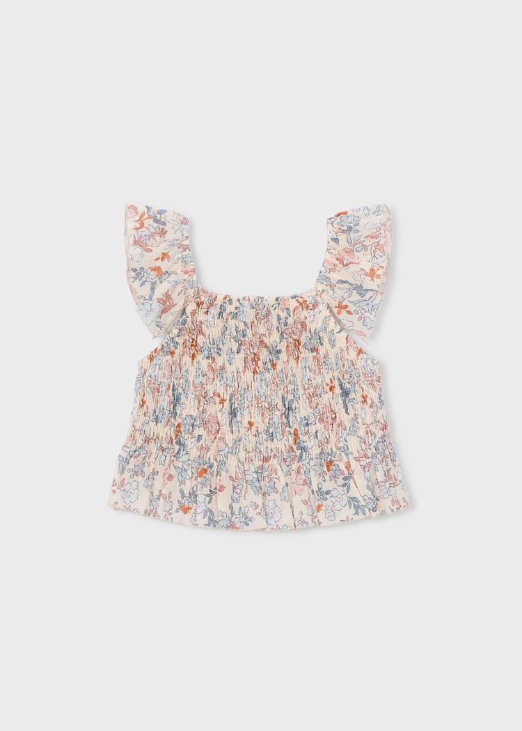Floral baby top on a light gray background