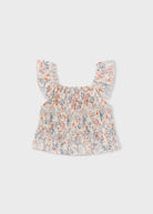 Floral baby top on a light gray background