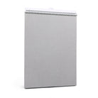 Gray spiral-bound notebook on a white background