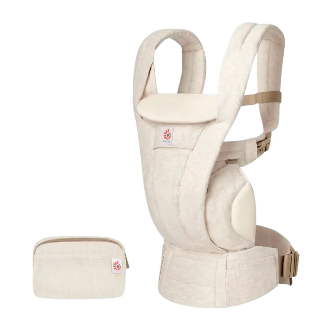A beige baby carrier with matching pouch, shown on a solid white background. The carrier has a textured linen-like fabric, padded shoulder straps, and a small brand label on the front.