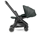 Dark forest green stroller on a white background