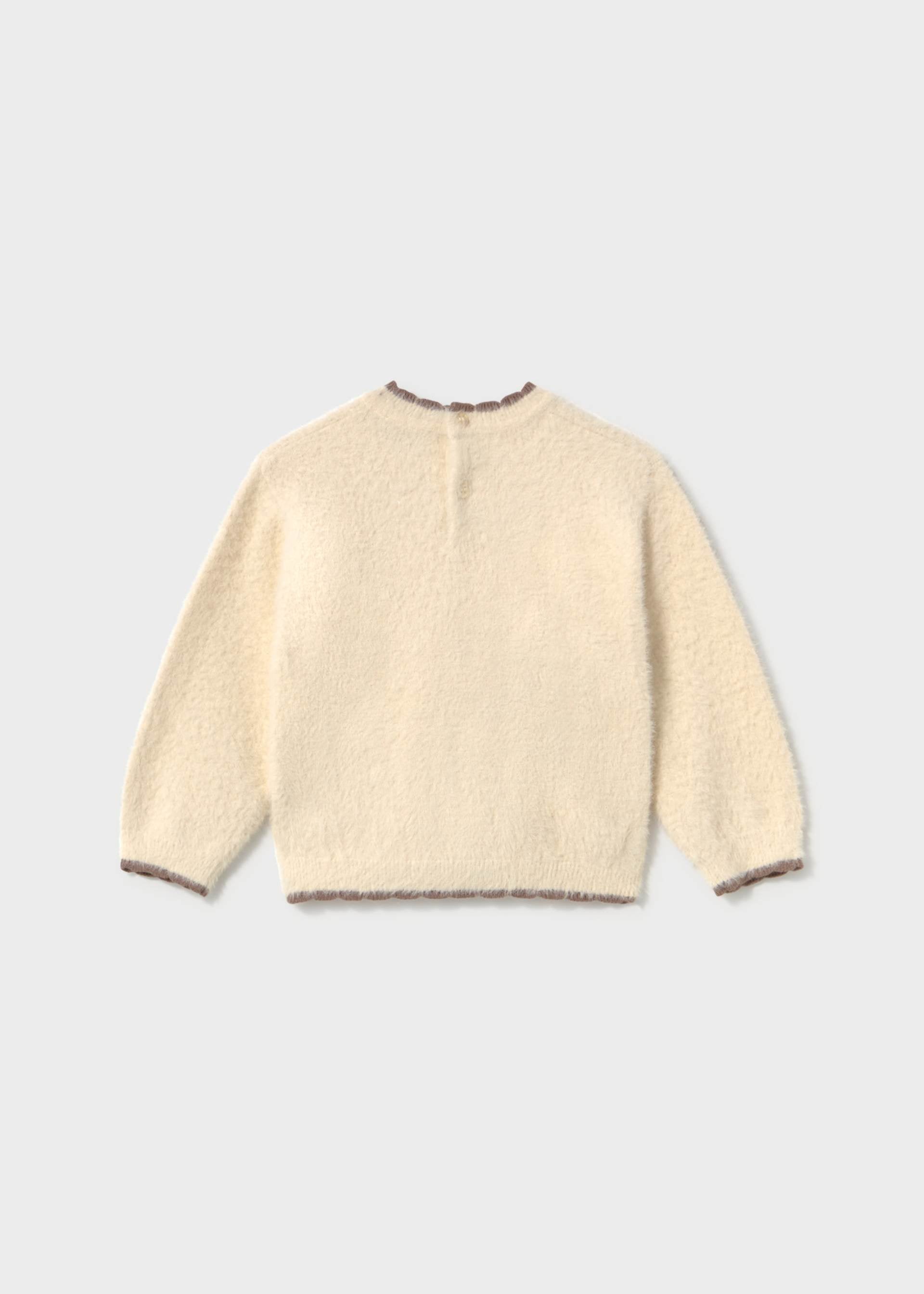 A cream-colored, fuzzy long-sleeve knit sweater shown from the back, featuring a crew neck and ribbed cuffs and hem, set against a light gray background.