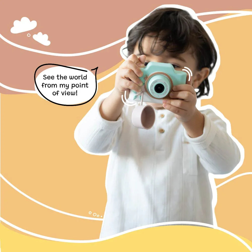 Child holding a toy camera with a speech bubble saying 'See the world from my point of view!' on a colorful background.