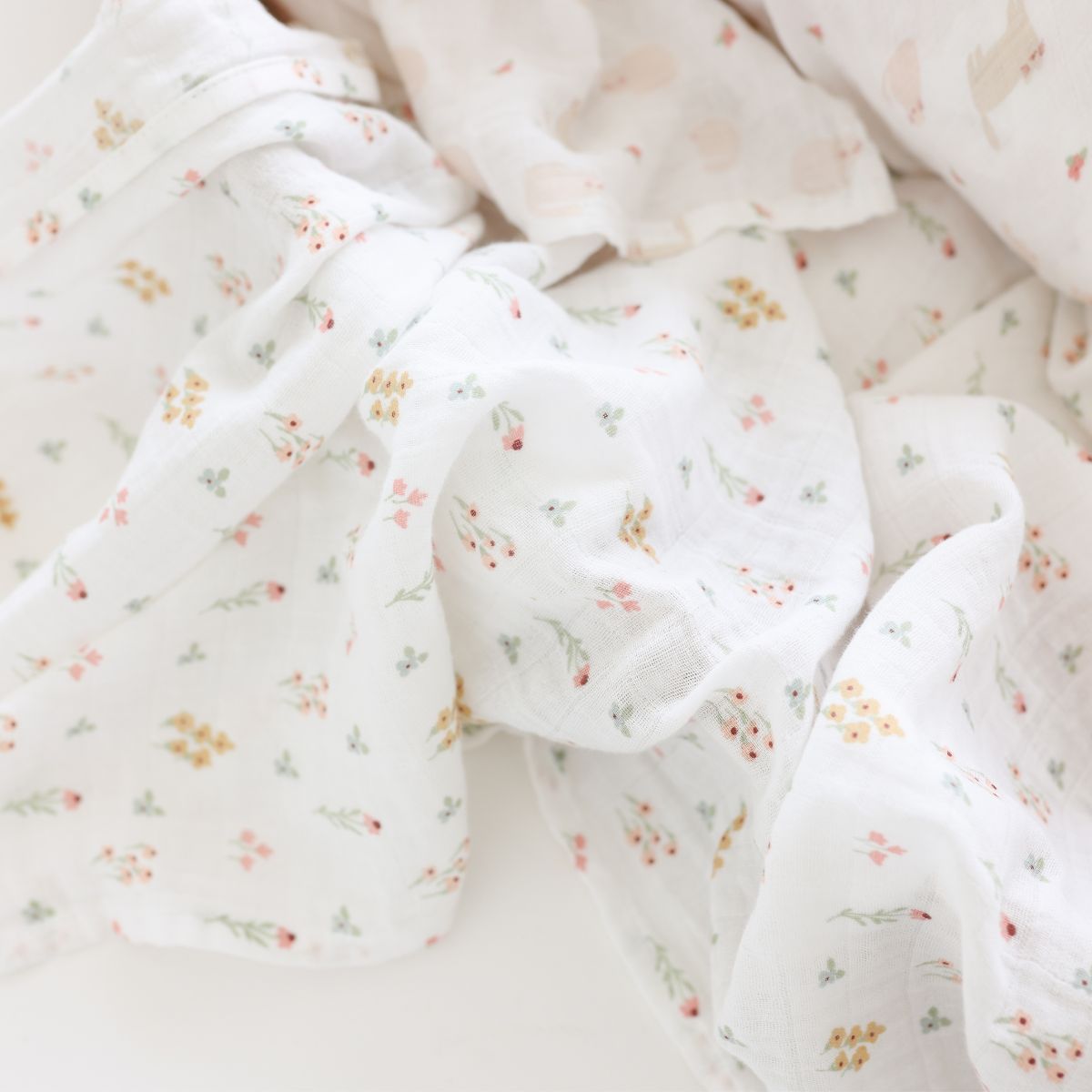 Floral patterned fabric with small flowers on a white background