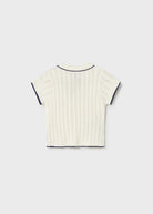 White ribbed knit t-shirt with black trim on a light gray background