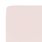 Close-up of a light pink fabric texture on a white background