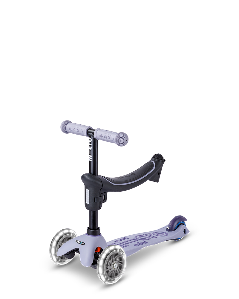Children's scooter with a purple handlebar and deck on a white background