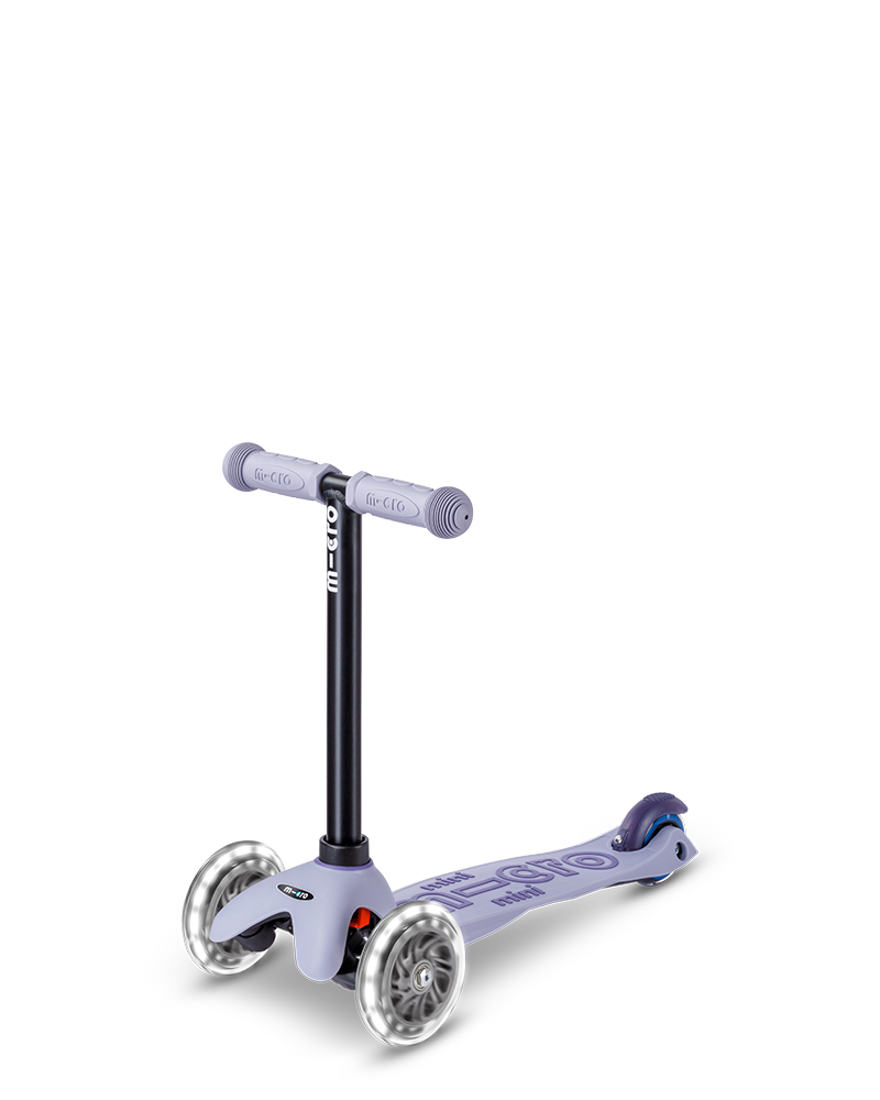 Children's scooter with purple handlebar and deck on a white background