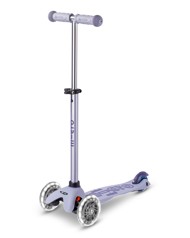 Children's scooter with purple handlebar and deck on a white background