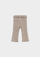 A pair of toddler flare leggings with a beige and brown leopard print pattern, featuring a ruffled waistband and ruffled cuffs, shown flat on a light gray background.