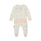 A baby long-sleeve footed sleeper in cream with a light blue and yellow unicorn print, featuring a pink ruffled trim at the waist.