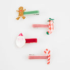 Set of Christmas-themed hair clips on a white background