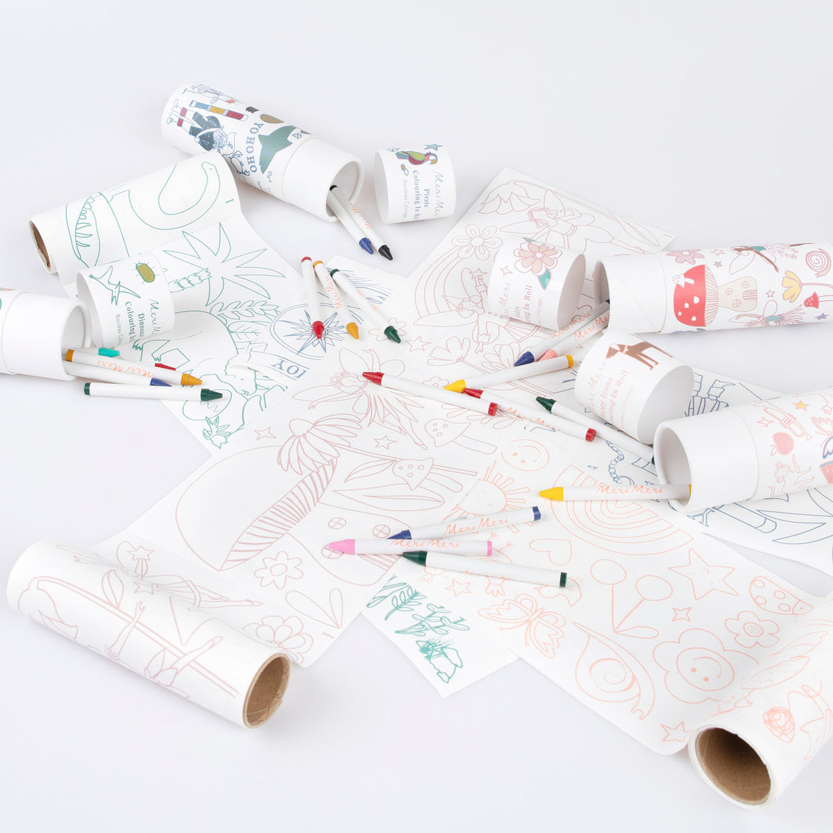 Coloring paper rolls with markers on a white background