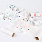 Coloring paper rolls with markers on a white background