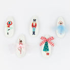 Decorative spoons with embroidered designs on a white background