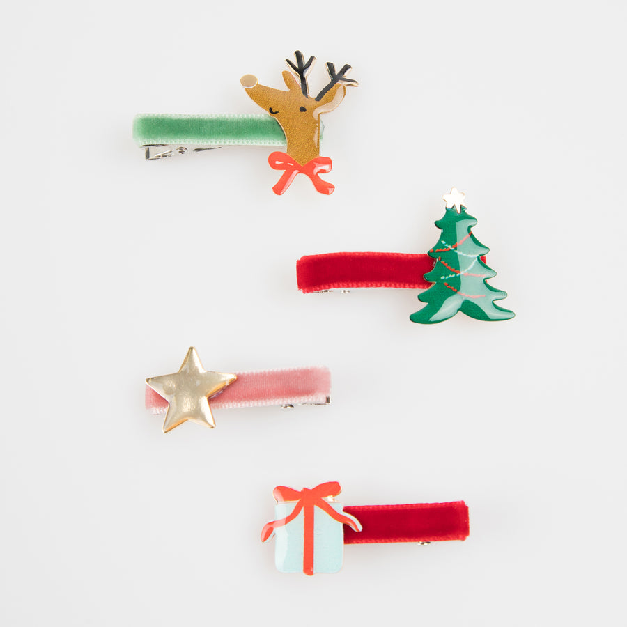 Set of Christmas-themed hair clips on a white background