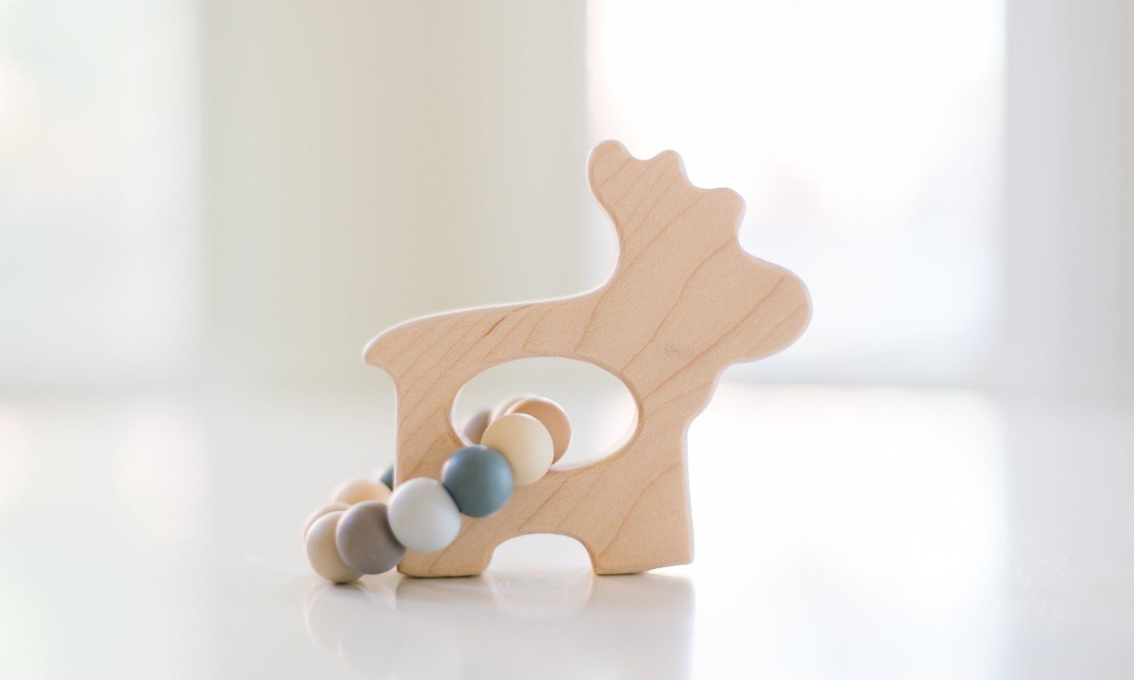 Wooden toy with beads on a white background