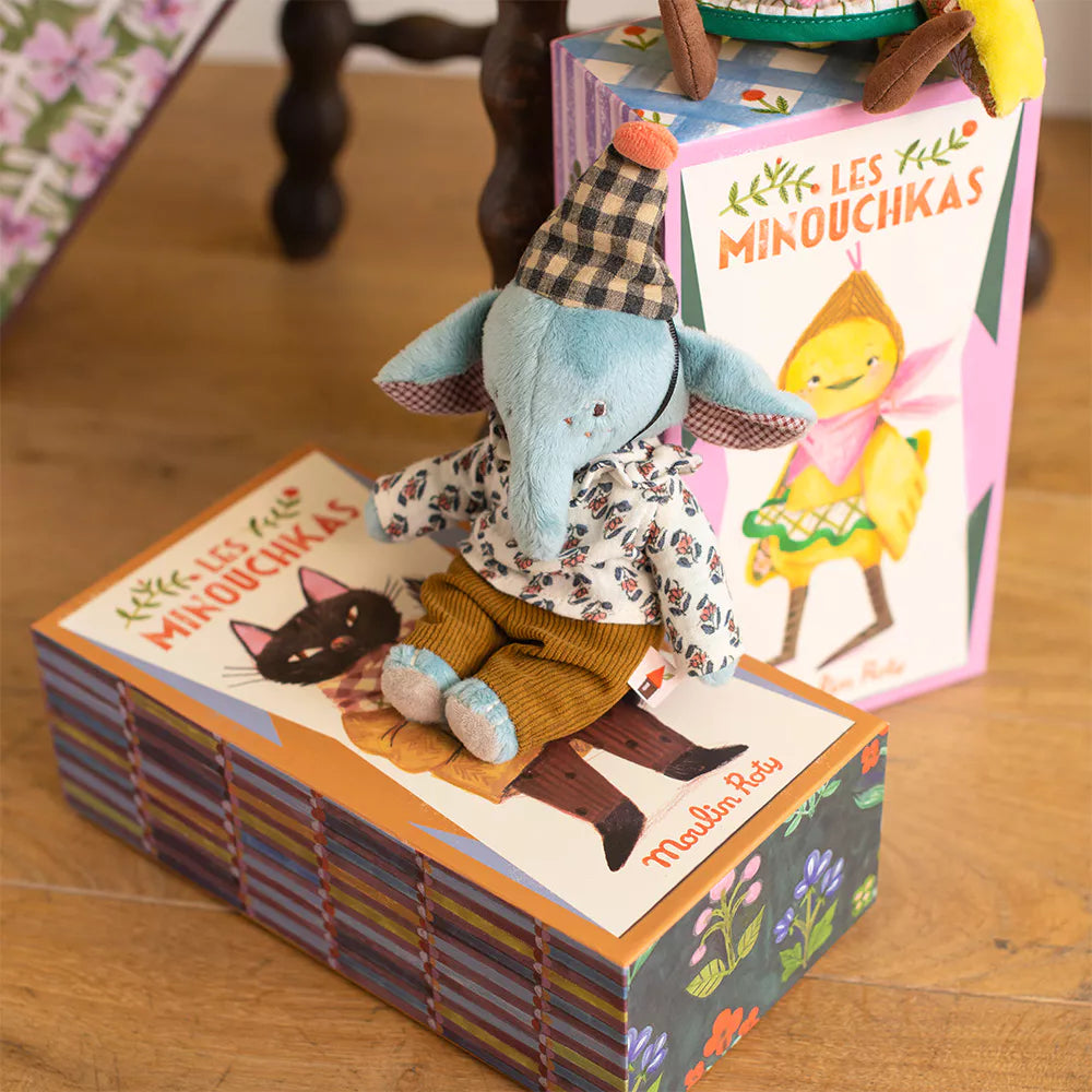 Children's books with animal illustrations on a wooden surface