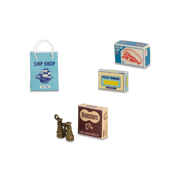 Collection of miniature packaging and accessories on a white background