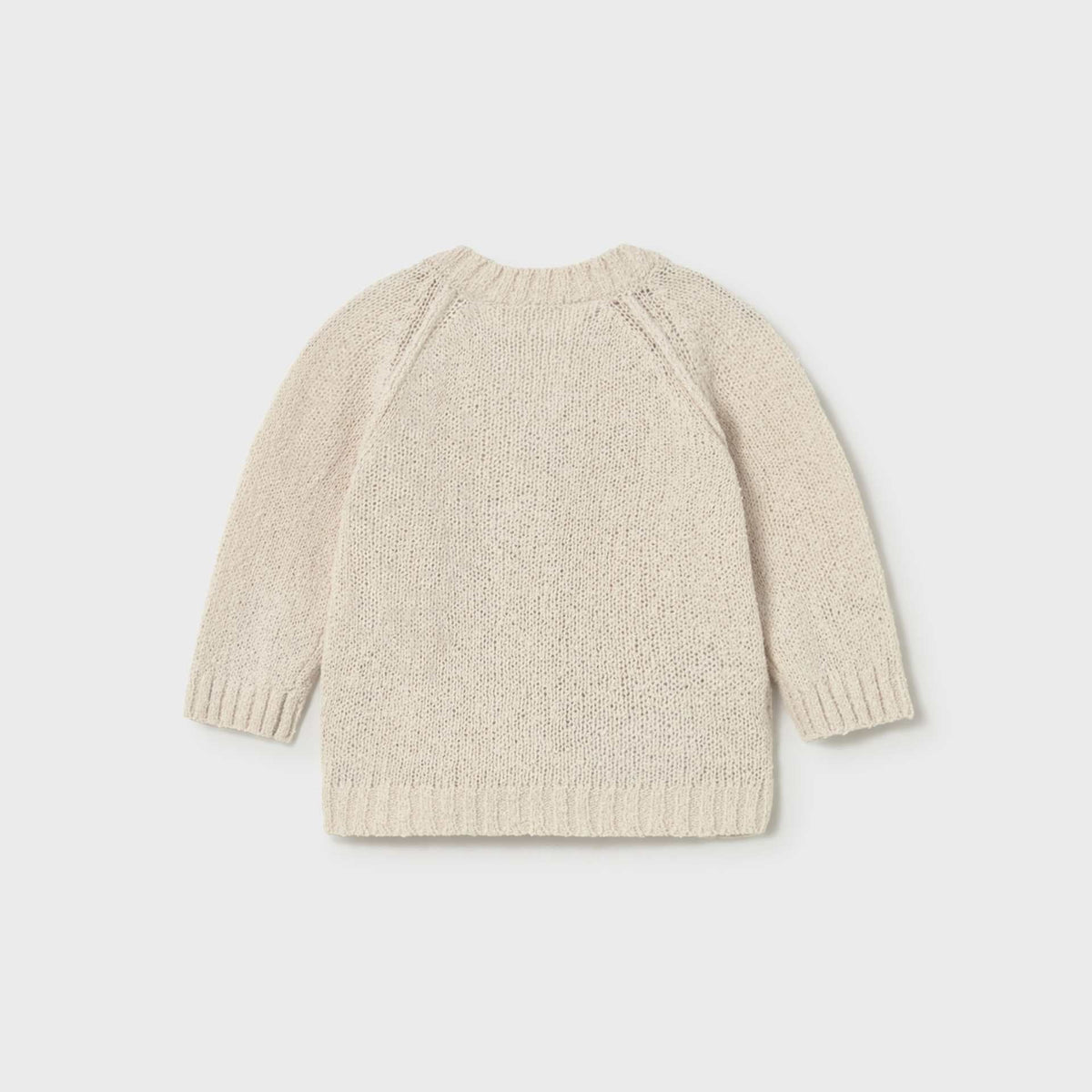 Beige knitted sweater on a light gray background
