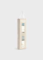 A tall, narrow beige cardboard package with a transparent window displaying folded socks in white, light blue, and gray. The brand name 'mayoral' is printed near the top, and a white hanging loop is attached at the top of the box.