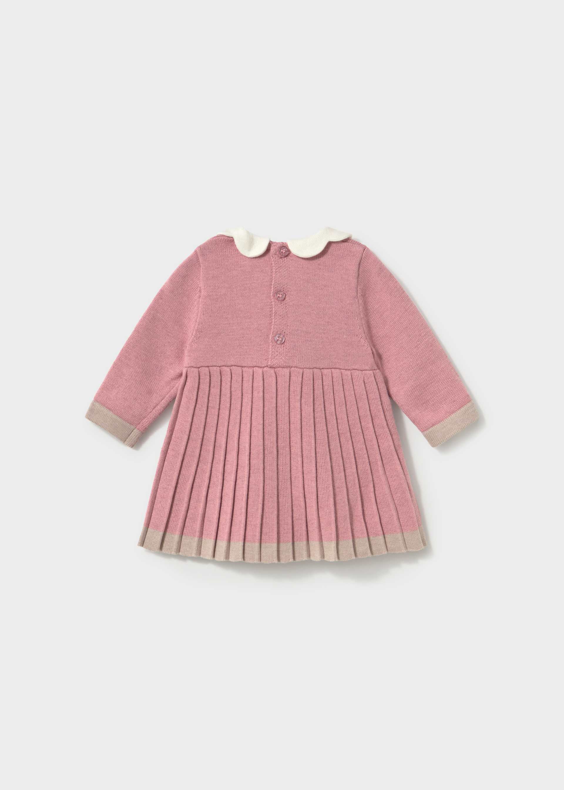 A pink long-sleeve knit dress for toddlers, featuring a pleated skirt, a white Peter Pan collar, and beige ribbed trim on the cuffs and hem.
