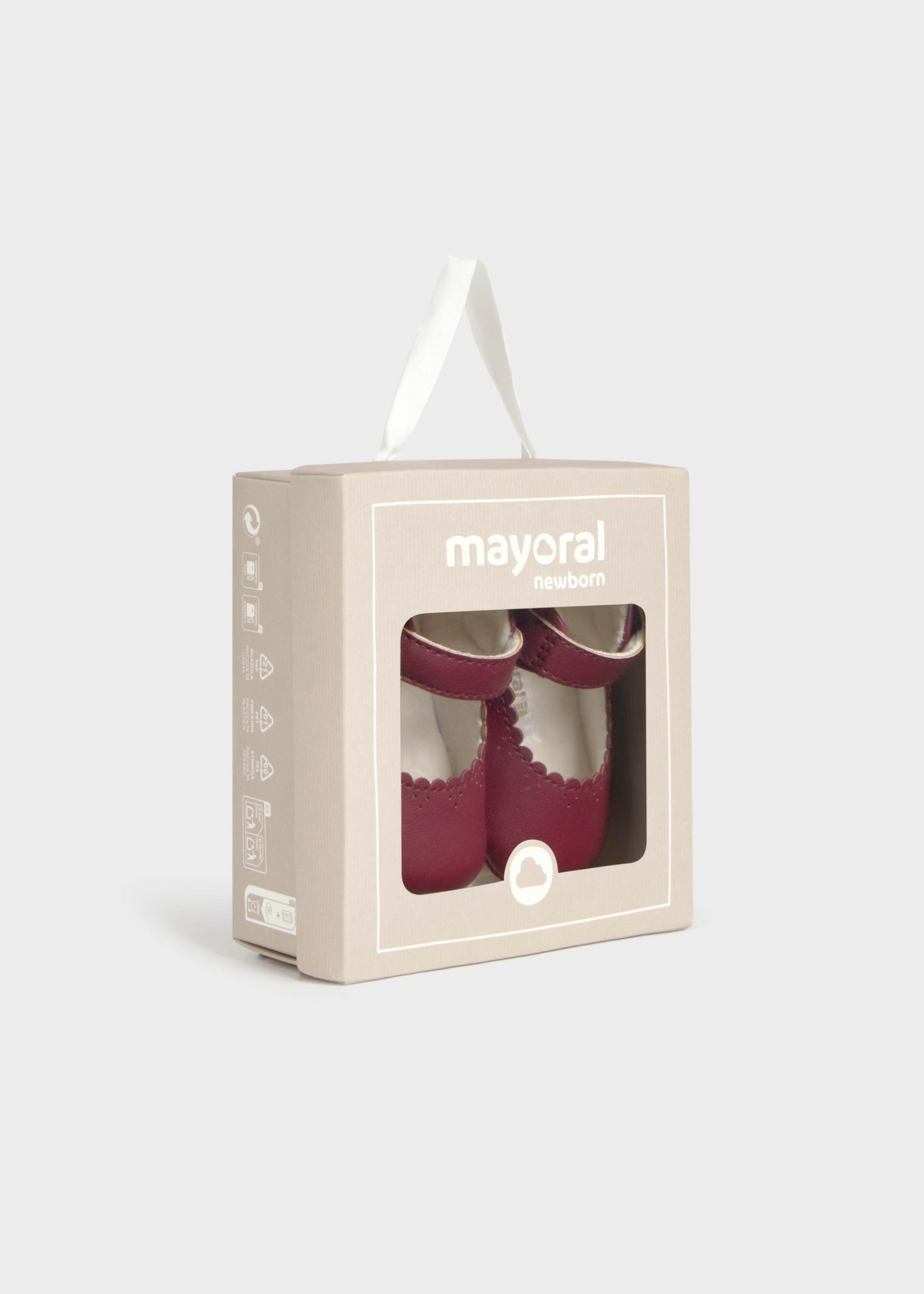 Mayoral baby shoes in a box on a light gray background