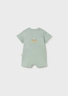 Light green baby romper with text on a white background