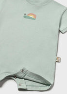 Light green baby romper with embroidered design on a white background