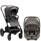A stroller and infant car seat travel system shown on a clean white background. The stroller is on the left with a black frame, gray fabric upholstery, and brown handle accents.