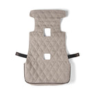 Quilted beige car seat cover with black straps on a white background