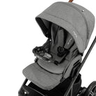 Snack tray shown attached to a a grey Nuna stroller