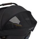 Black baby stroller with mesh window on a white background
