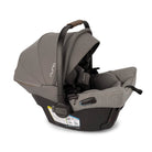 Gray and black car seat with Nuna branding on a white background