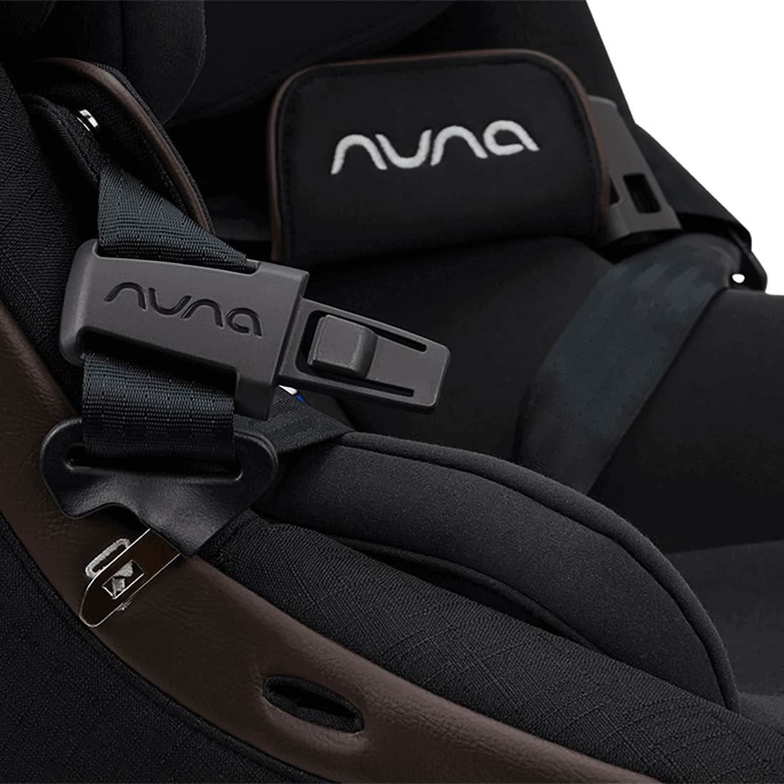 Nuna car seat with black straps and logo on a white background