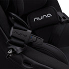 Close-up of a black Nuna car seat with visible branding.