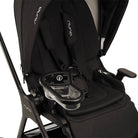 Close-up of a black Nuna stroller with a clear and black cup holder attached to the seat, shown against a white background.