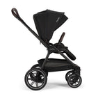 Black stroller with canopy on a white background