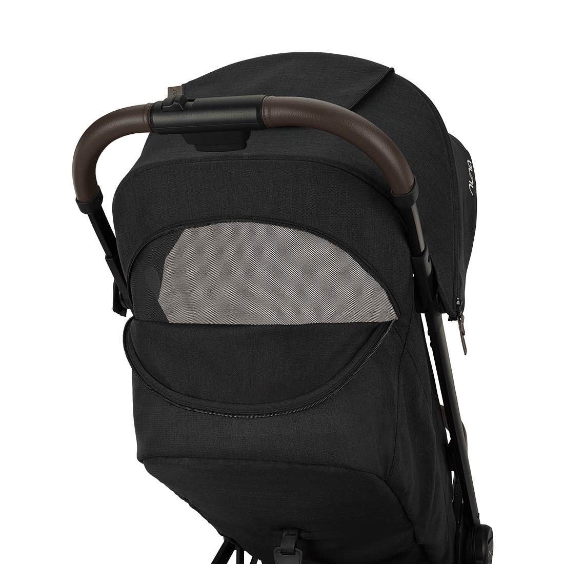 Nuna TRVL 360 lightweight travel stroller in Caviar black, shown from the rear with the canopy extended to reveal a mesh ventilation window and a brown leatherette pushbar against a clean white background.