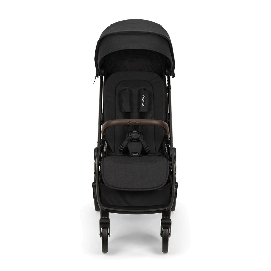 Nuna TRVL 360 lightweight travel stroller in Caviar black, shown in a front view against a clean white background. The stroller features an extended sun canopy, a brown leatherette-accented pushbar and rotating armbar, a harness with a magnetic buckle, 360-degree swivel wheels, and an under-seat storage basket.